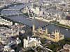 aerial photograph of London showing Houses of
                  Parliament and Westminister Abbey with Millenium wheel
                  behind