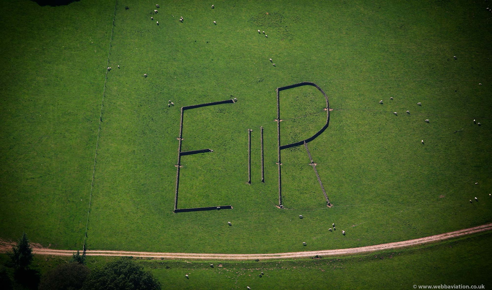  letters E II R laid out in stone walls near Chatsworth House  from the air 