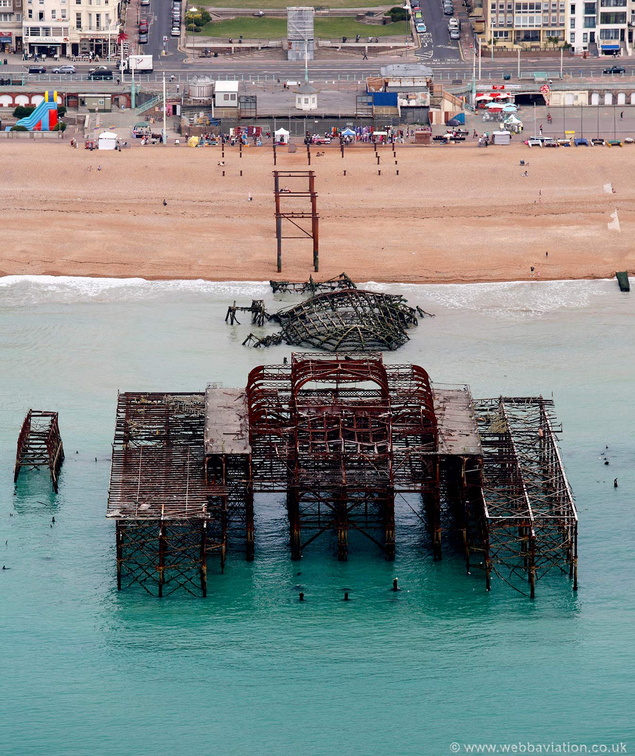 The ruins of West Pier, Brighton lie derelict and abandoned, viewed from the air