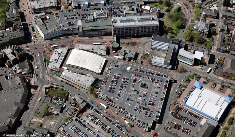  old Market Buildings and Multi story car park in Blackburn from the air  