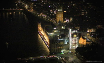 Elizabeth Tower and Big Ben restoration London at night from the air