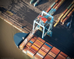 container crane unloading the container ship at the Liverpool aerial photograph