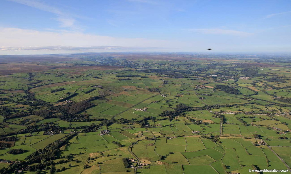 Bell Huey Helicopter over Menwith Hill Yorkshire  aerial photograph