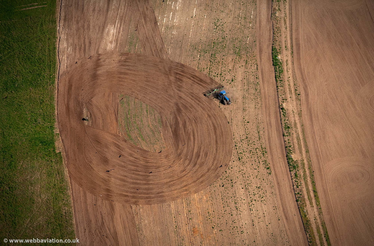  tractor ploughing in a circle from the air