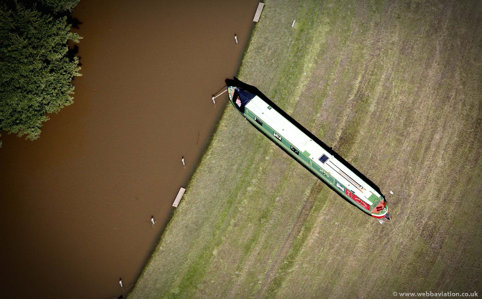stranded Canal Boat on the River Avon at  the Barton,Warwickshire during the great floods of 2007 from the air