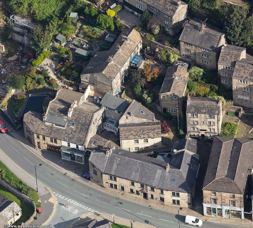 traditional stone cottages built higgledy-piggledy into the hillside in Holmfirth viewed  from the air 