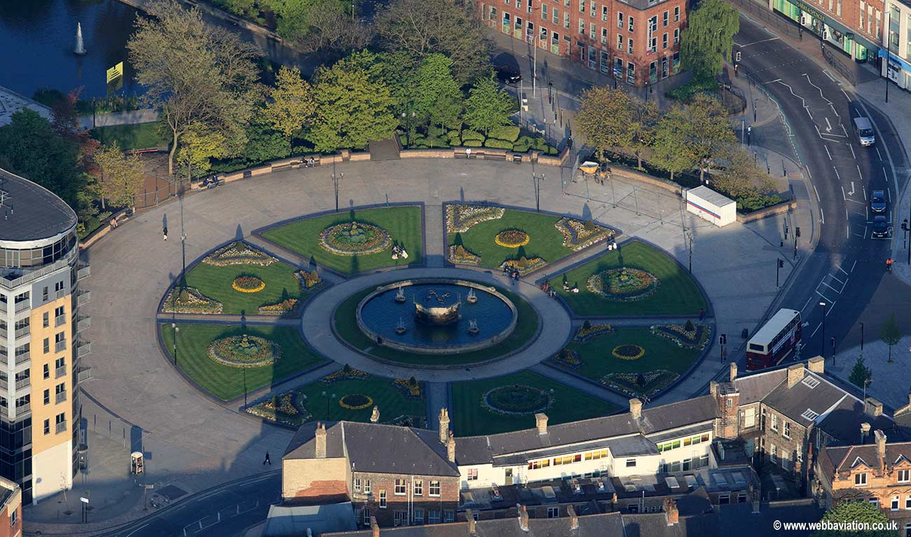 Queens Gardens Hull showing people sitting round the fountain on a summer evening.   aerial photograph
